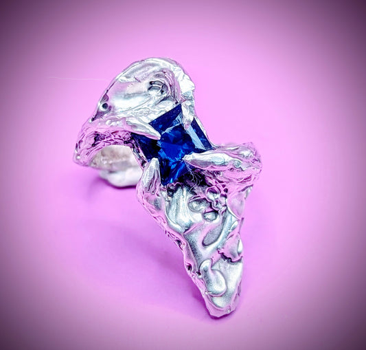 Handmade lost wax silver ring with deep blue nano sapphire – molten abstract design