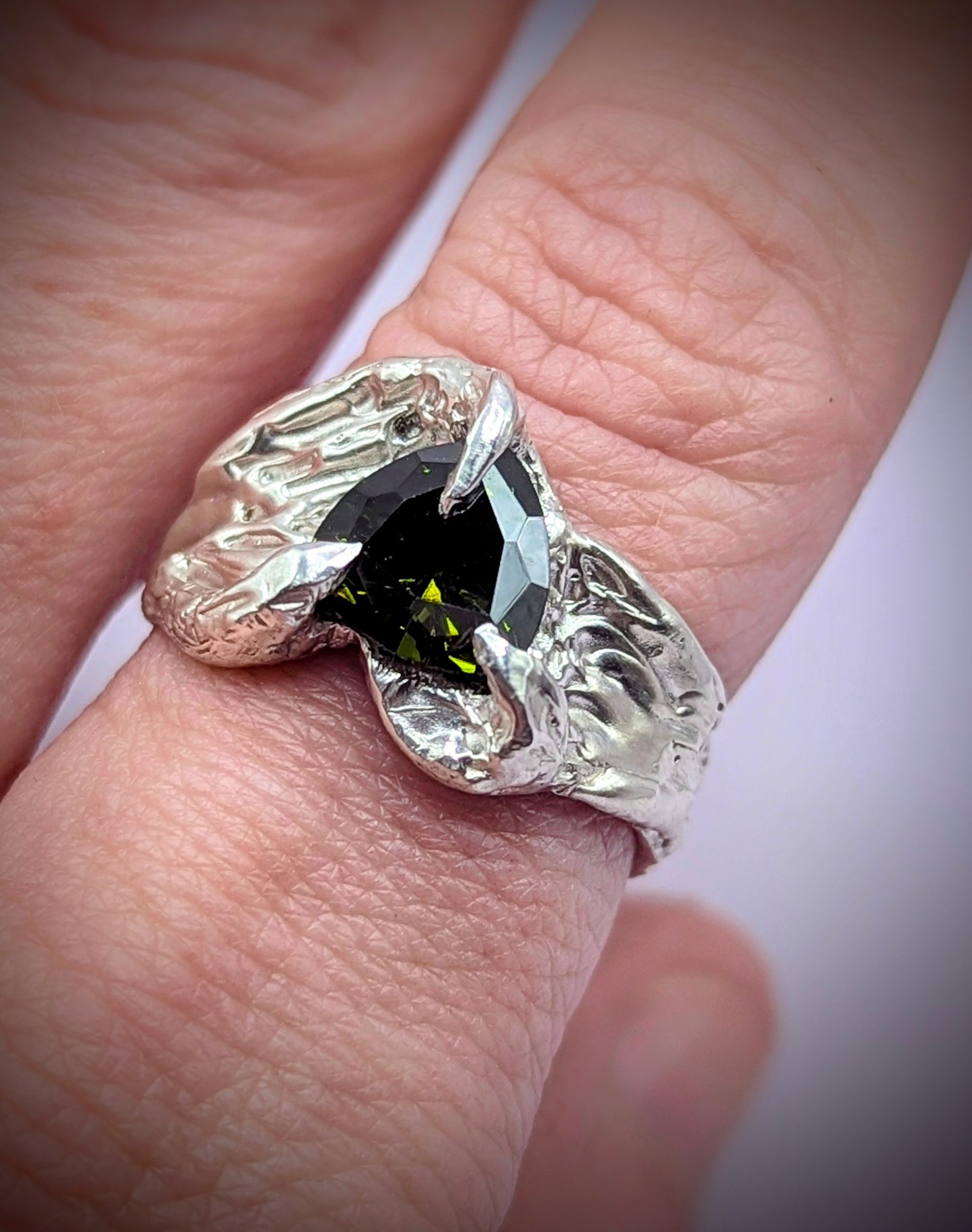 Sculpted silver ring with protective claw design – edgy handmade statement piece