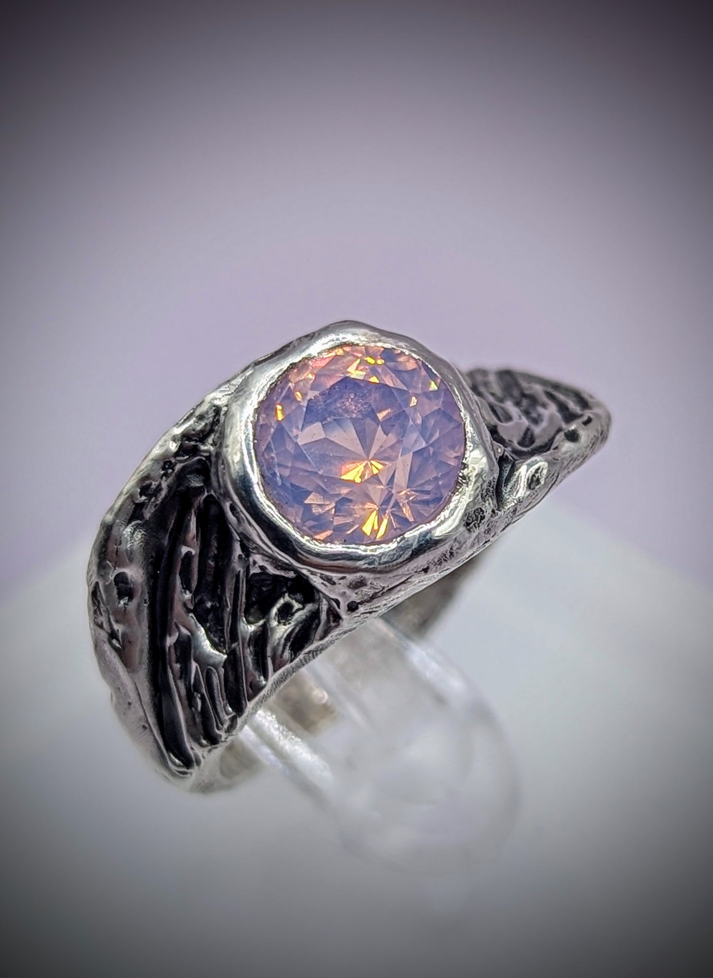 Wing-shaped silver ring with soft pink stone – symbolic handmade jewellery for transformation