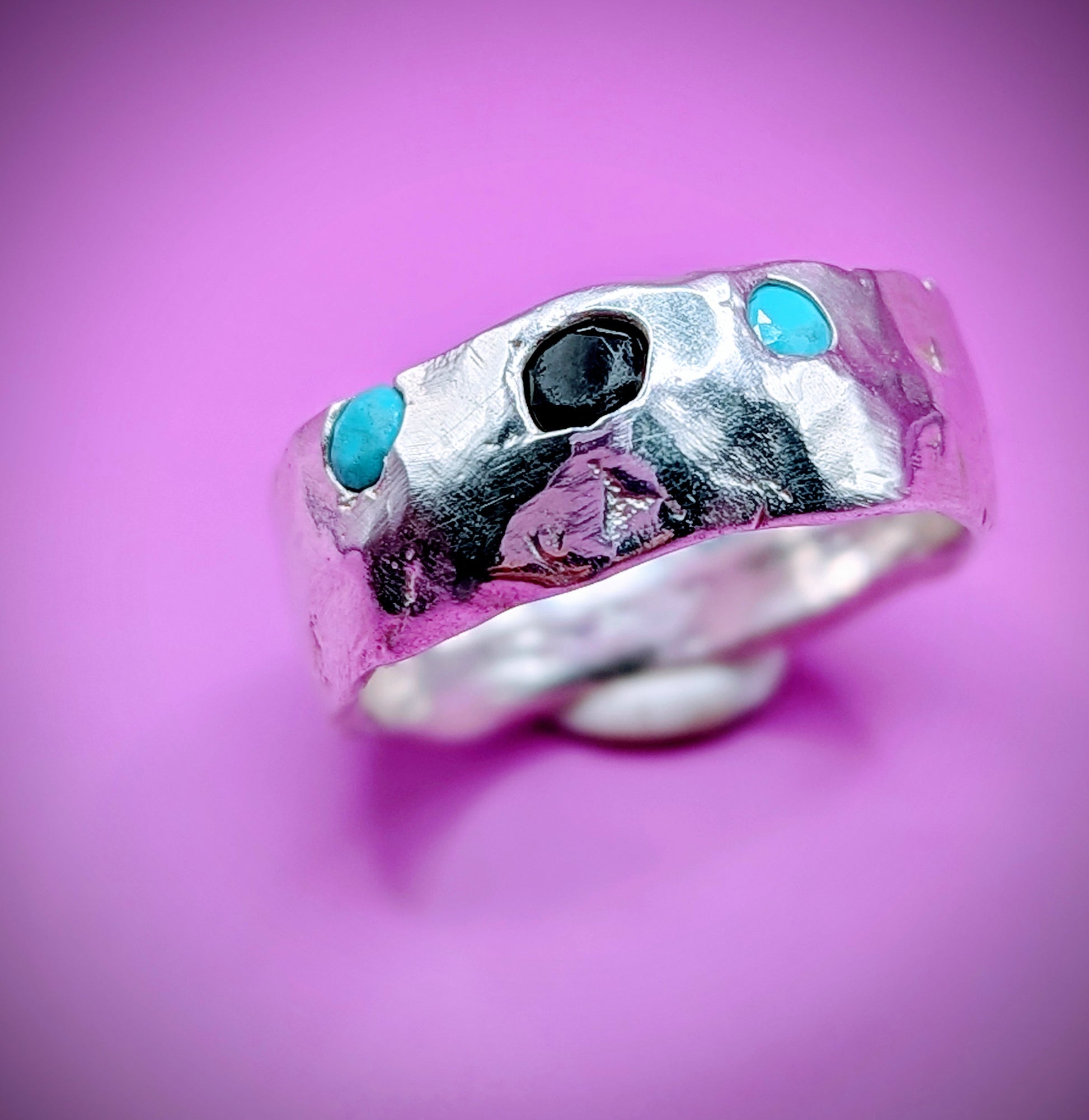 Handmade sandcast silver ring with turquoise and onyx nano gems – raw textured design