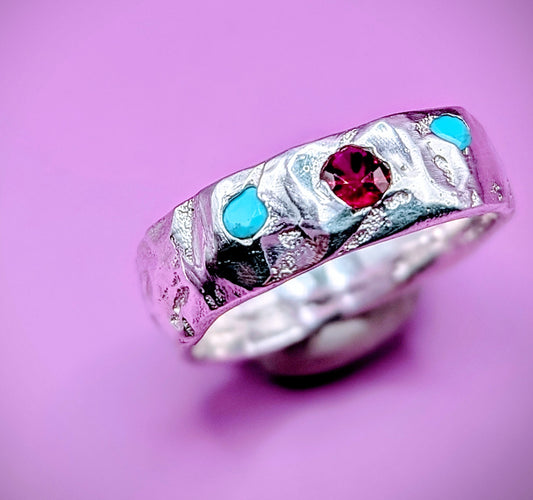 Handmade sandcast silver ring with ruby and turquoise nano gems – joyful bold design