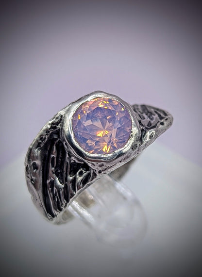 Wing-shaped silver ring with soft pink stone – symbolic handmade jewellery for transformation