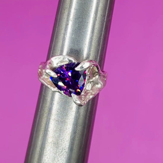 Close-up video of handmade silver ring with Amethyst on mandrel – sculptural detail and gemstone