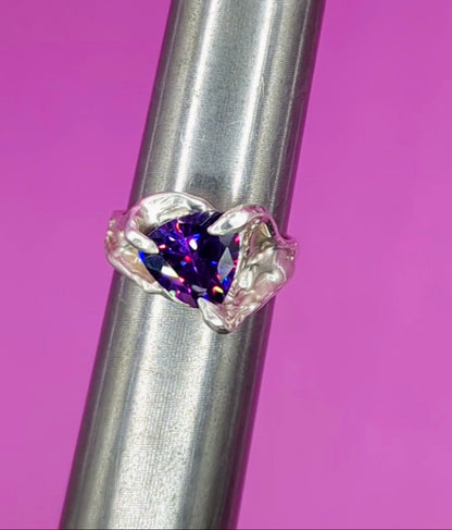 Close-up video of handmade silver ring with Amethyst on mandrel – sculptural detail and gemstone