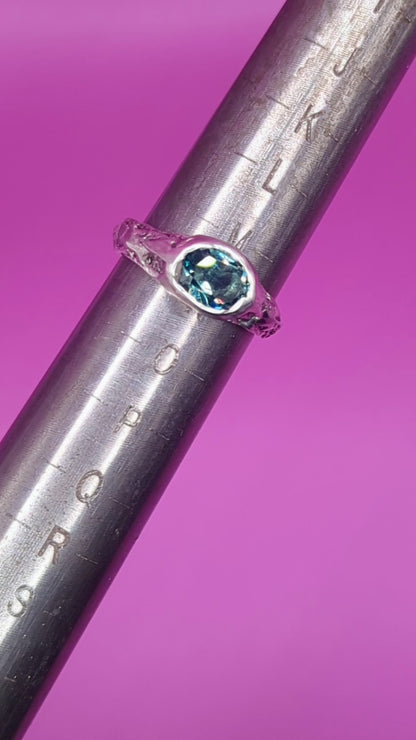 Mandrel view of handmade silver ring with Alexandrite – sandcast textured band close-up