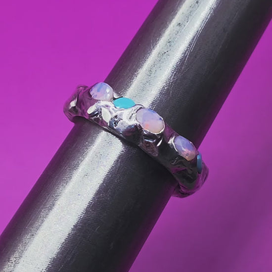 Video of sandcast ring with nano opals raw bold texture recycled sliver and eco friendly gems 
